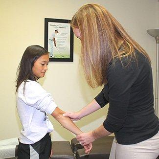 Dr. LaRocque performing wrist adjustment