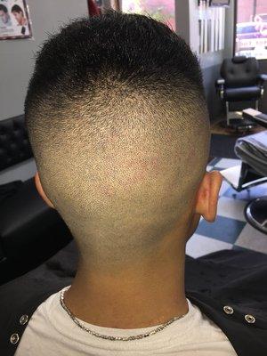 High and tight bald fade share and comb work on top.