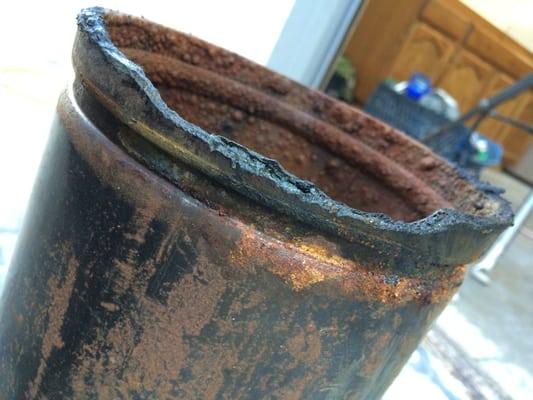 Pipe corrosion that caused a leak.