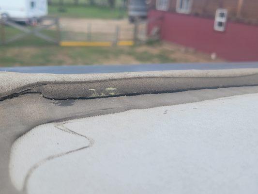 Cracks on roof where water can come into Keystone.  Front bedroom has water damage.  1st camping trip with new trailer. Poor caulking