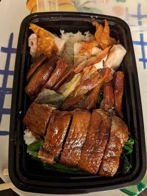 Three "treasures" rice... Any three meats over rice. Pictured: roast duck and pork as well as crispy pork