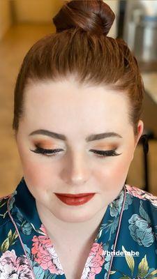 Glowing natural, make up with orange, browns and golds.