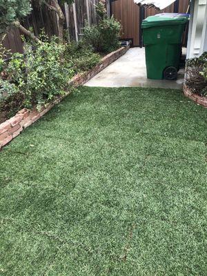 Added concrete pad for the trash bins. No more mud after  rains