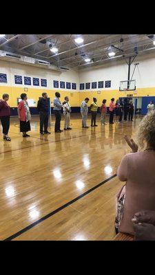 Excellent, hard working educators lineup at an assembly