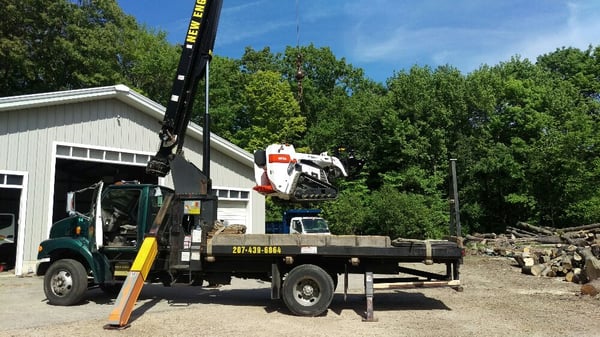 Our crane and mini bobcat combo gets us in and out without a trace.