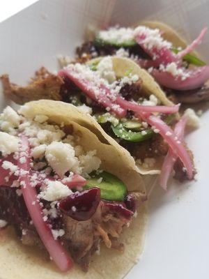 Duck tacos-- made with berry gastrique, jalapeños, pickled onions, queso fresco