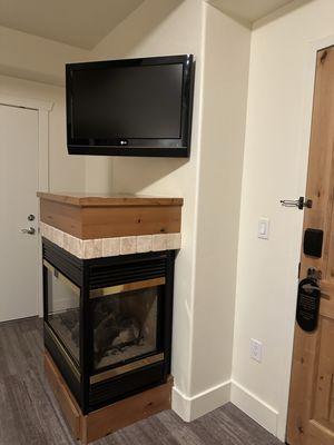 Fire place.  Desk is behind it.  Door to an adjoining room.