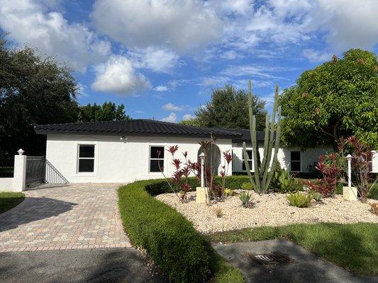 This customer had a standard red tile roof and wanted to change the appearance of his home. Roof was painted black and entire house white.