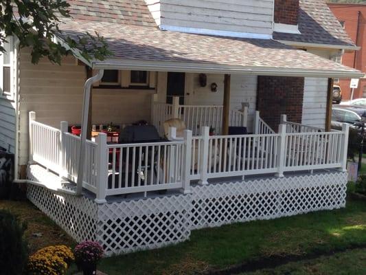 We tore down an old porch from the early 1900's and built this custom covered deck for a customer with vinyl railing