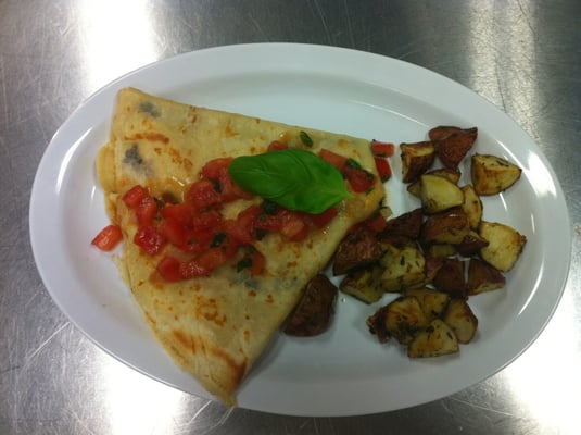 Our 'Bruschetta Bandit' is a crepe with marinated chicken, fresh mozzarella, and a balsamic reduction topped with bruschetta