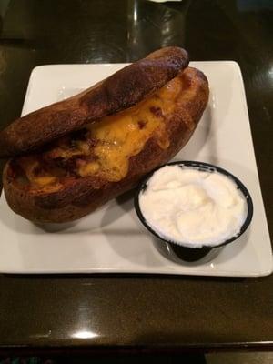 Twice baked Baked Potato w/ sour cream on side.