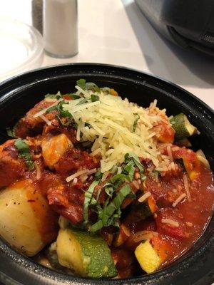 Wheat penne pasta (only a little, buried on bottom), veggies, chicken, marinara.