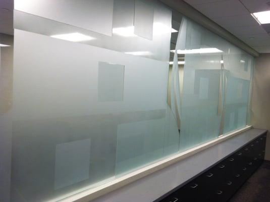 Custom sandblasted glass divider.