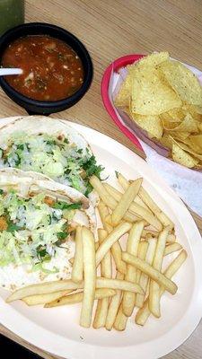 Veggie taco (flour tortilla,cilantro,lettuce,avocado,onions,beans and rice) with a side of fries