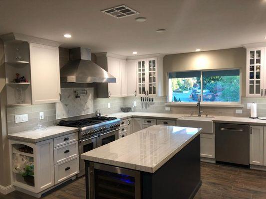 Starmark cabinetry in white maple and blueberry maple island with Stratford door style