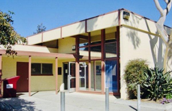 Front of library, the entrance, and where you can drop a book off.