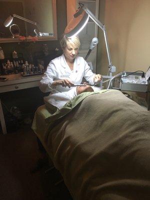 Lynn performing microcurrent non-surgical face lift.