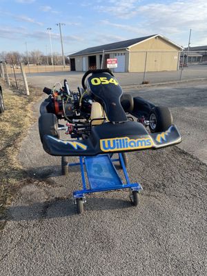 The owner came out and inspected the kart. He made sure everything was safe and ready to go on the track.