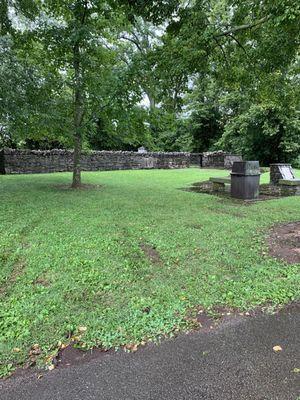 Stone fence around Cemetery.