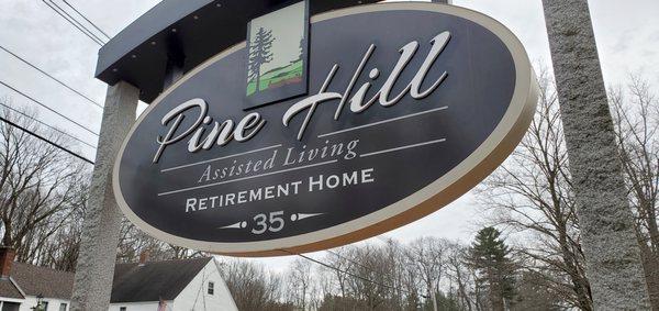 Up close photo of Pine Hill location sign.