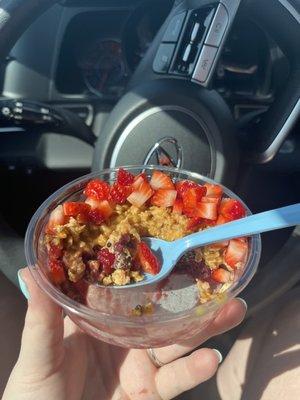 Açaí bowl with strawberries, granola, and peanut butter