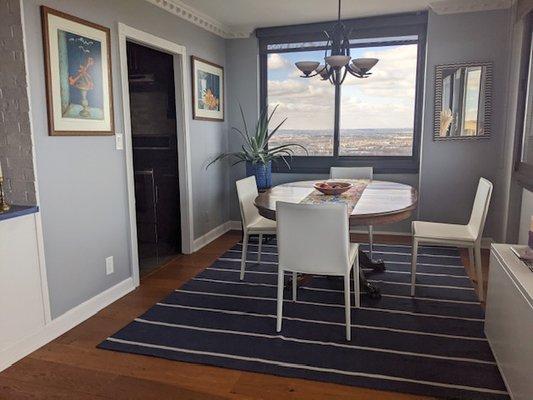 After photo of Dining Room. The new color brings the outside into this high rise space.