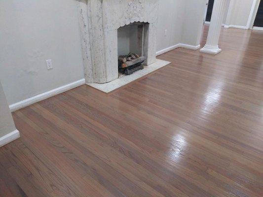 Sanded and refinished wood floors with weathered oak stain.