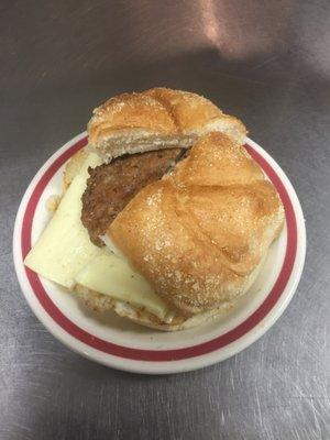 Sausage egg and cheese on a hard roll