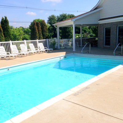 Sparkling swimming pool with lounge chairs