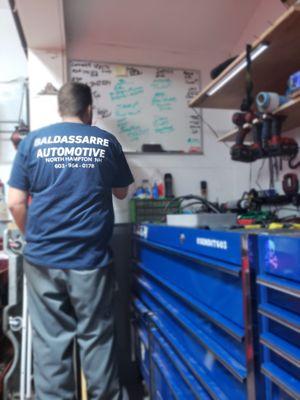 Mike Baldassarre planning the day's operations at Baldassarre Automotive. Trust your car to us for top-notch care. Call (603) 964-0178!