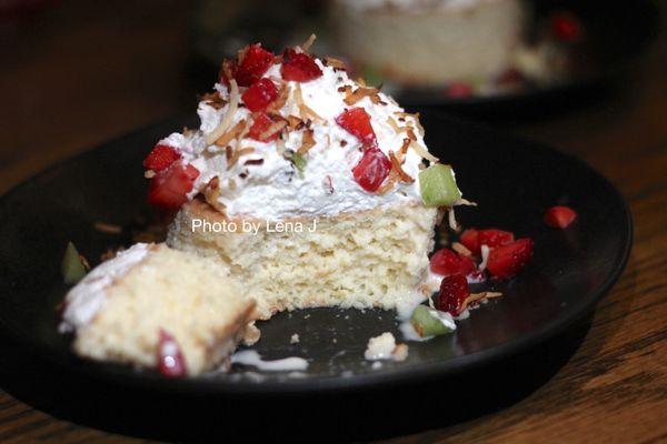 Inside of Tres Leches Cake ($10) - strawberry, kiwi, whipped cream, toasted coconut. Very moist.