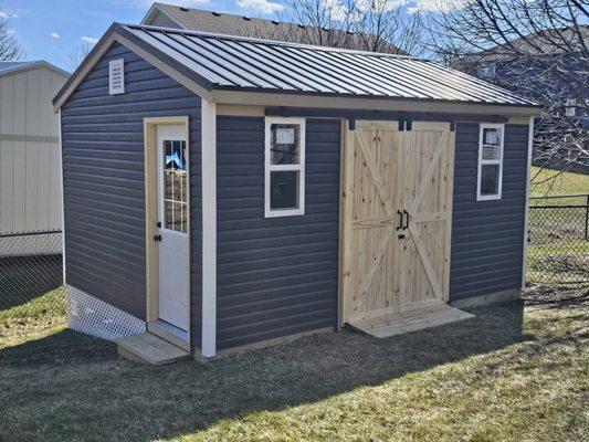 12x16 Gable with vinyl siding,  metal roof, barn doors