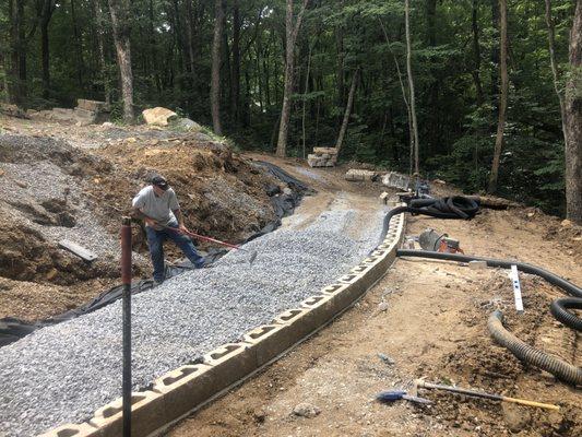 The beginning of a total makeover including 3 retaining walls, and Travertine pool deck