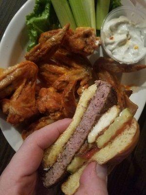 The 1/2 lb burger was on special. We added bacon and cheese curds for effect. The wing portion is huge for the price. Crispy and delicious!