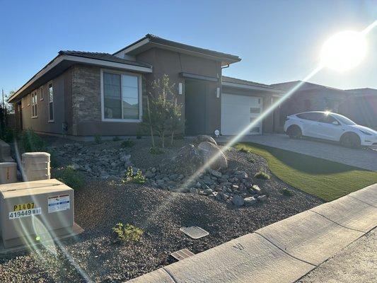 Front yard from left with riprap for drainage- colors match exterior