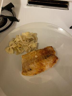 Baked cod dinner transferred to a plate