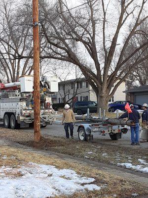 The crew finally cleaning up and taking out the old piece of post off my property