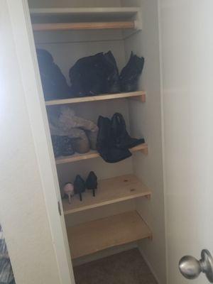 New shoe rack in entry way closet is very functional and keeps the clutter organized!