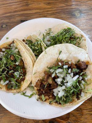 Pastor tacos on flour tortillas.