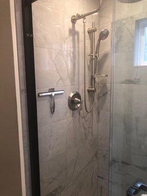 Shower heads at both ends of shower.