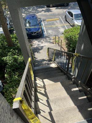 ALWAYS DOING CONSTRUCTION! Caution tape up the stairs I have to take to get to my place.