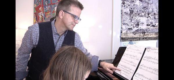 A Bach minuet teaches students musical counterpoint and independence of hands.