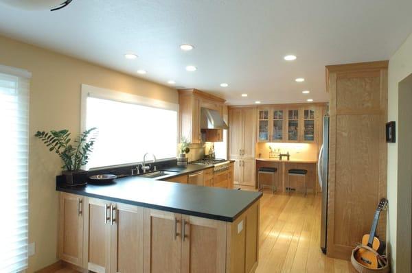 Warm contemporary kitchen in a 1950's home in San Leandro. Some structural work, new door/windows to enlarge kitchen.