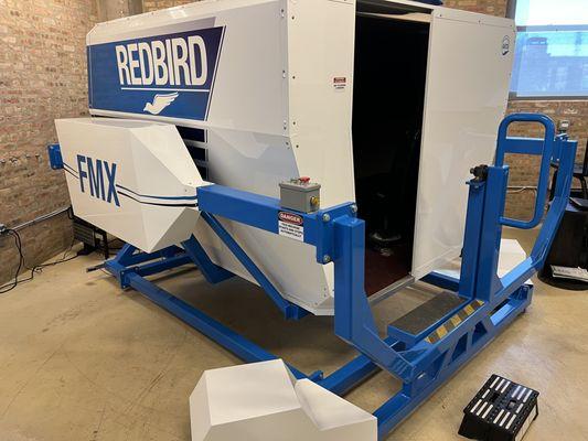 Exterior view of FMX Redbird Flight Simulator.