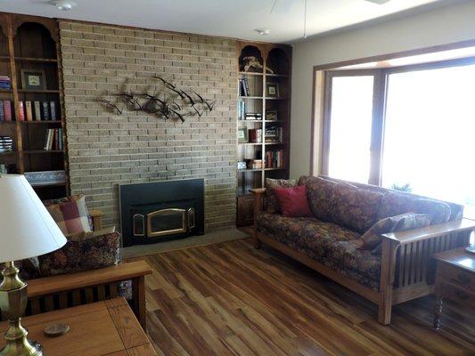 Enjoy the fireplace in the Family room bay with bay windows overlooking the lake