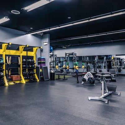 Functional Training Area with Turf, Kettlebells, Med Balls, and TRXs