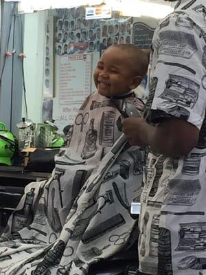 My 2 year old enjoying his haircut by Howard