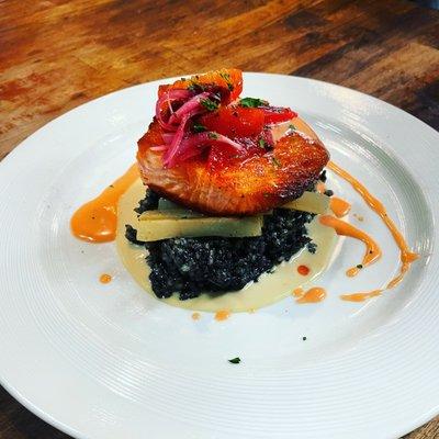 Pan seared ora king salmon | squid ink risotto | sauce maltise | citrus salsa .