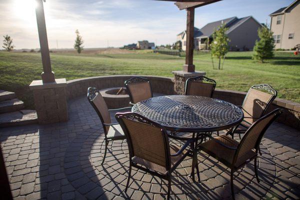 Paver patio, fire pit, outdoor dining, seat wall, cedar pergola.