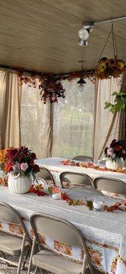 Pumpkin flower arrangements and backdrop